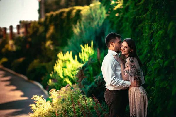 Beautiful young couple on a nature background — Stock Photo, Image