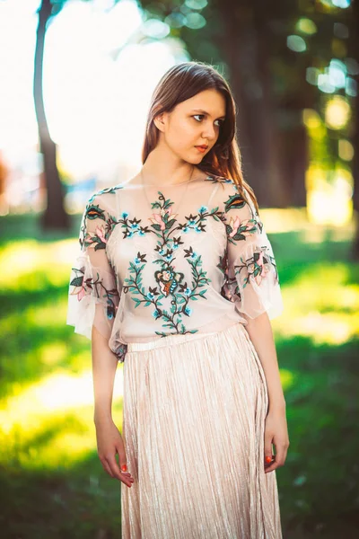 Beautiful young girl on a nature background — Stock Photo, Image