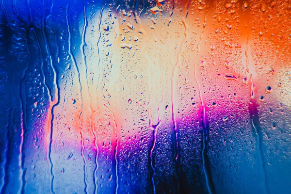 Raindrops on a blurred multicolored background — Stock Photo, Image