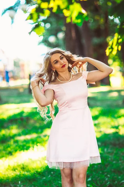 Beautiful girl blonde on nature background — Stock Photo, Image