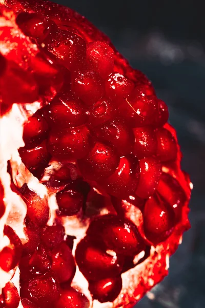 Red sliced pomegranate on a blue abstraction background — Stock Photo, Image