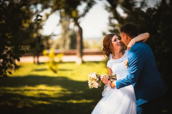 Couple groom and bride against the background of orange leaves — Stock Photo, Image