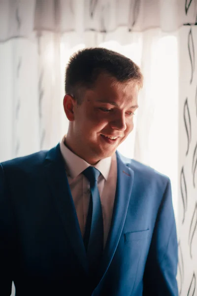 Portrait of the groom on a light background — Stock Photo, Image