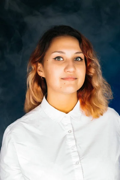 Emotional young girl on a dark background — Stock Photo, Image