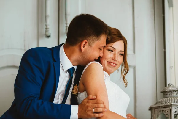 Couple groom and bride against the background studio — Stock Photo, Image