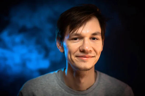 Portrait emotional young man on blue background — Stock Photo, Image