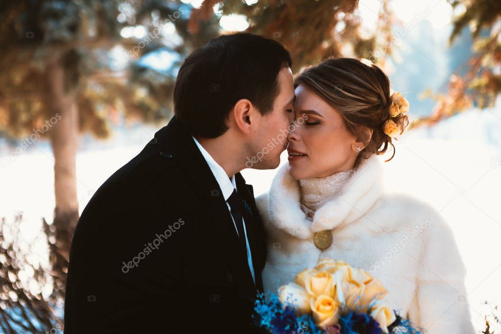 Winter bright wedding bride and groom couple