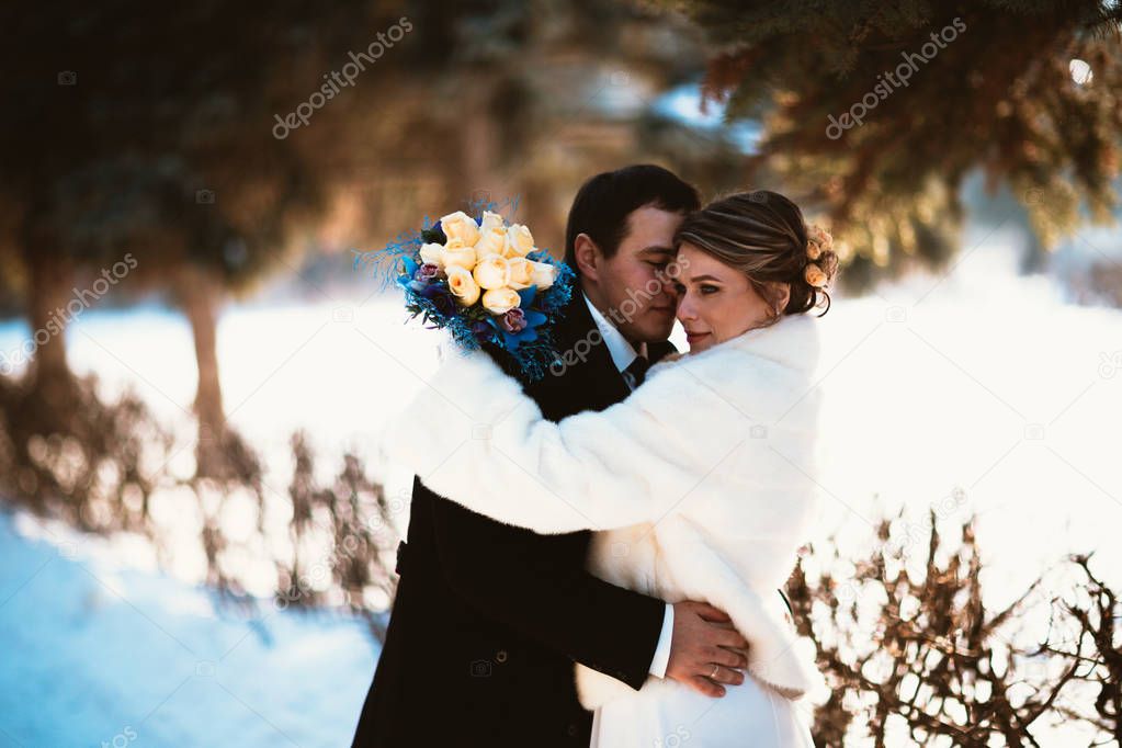 Winter bright wedding bride and groom couple