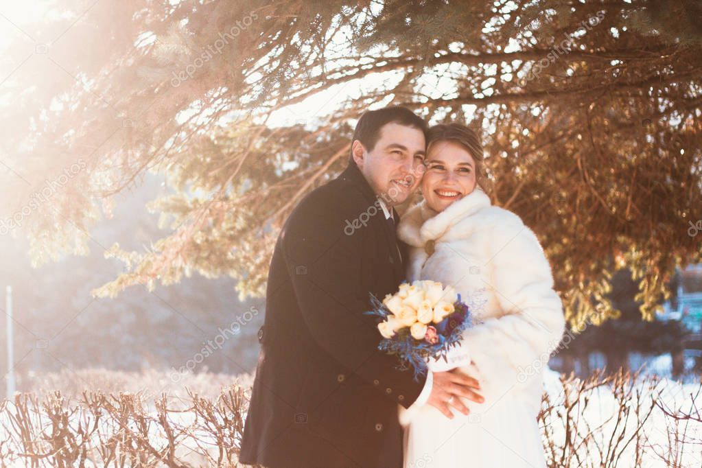 Winter bright wedding bride and groom couple