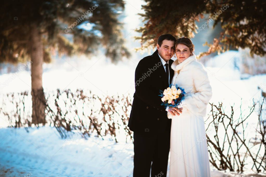 Winter bright wedding bride and groom couple