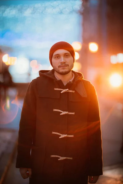 Guy in the coat on the city background — Stock Photo, Image