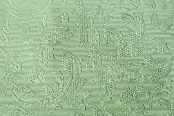Background in pastel tones with an embossed pattern.