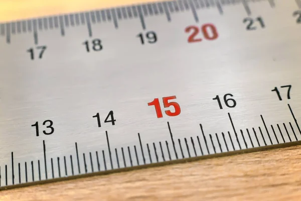 A fragment of metal measuring ruler. — Stock Photo, Image