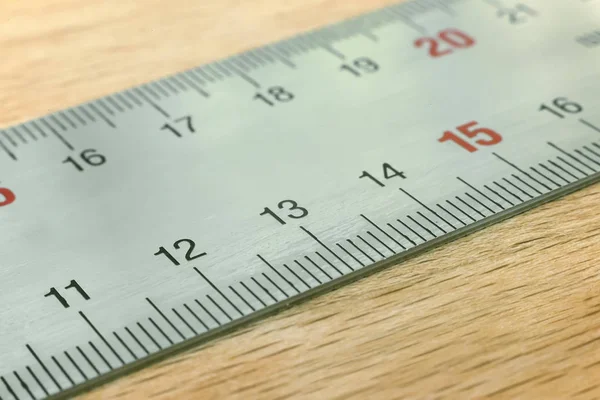 A fragment of metal measuring ruler. — Stock Photo, Image