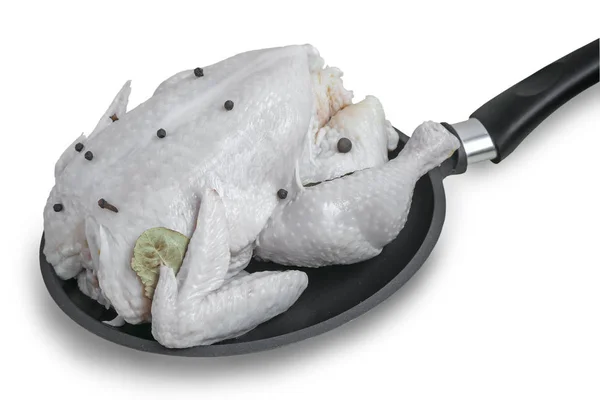 The chicken on the frying pan on a white background. — Stock Photo, Image