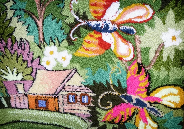 Needlework, a fragment of woven panels depicting a house and butterflies. — Stock Photo, Image