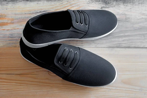 Summer sports shoes with a black cloth top. — Stock Photo, Image