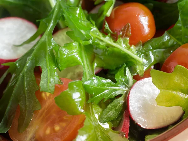 Salad of fresh vegetables and herbs on the table. — Stock Photo, Image