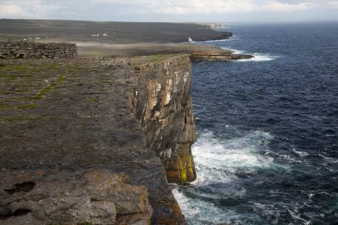 Views of the rocks Dun Aonghasa on the island Inishmore clipart