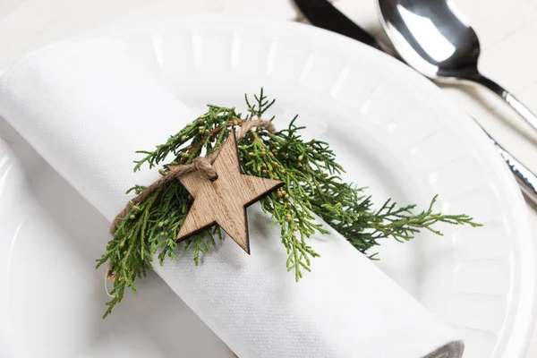 Christmas table setting with natural ornaments