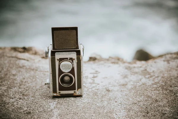 Vintage camera on a wall — Stock Photo, Image