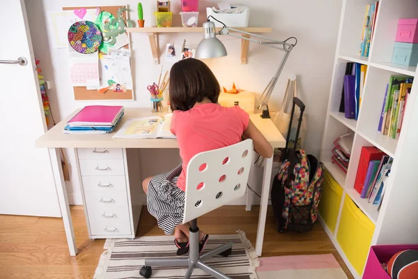 Young girl doing homework — Stock Photo, Image