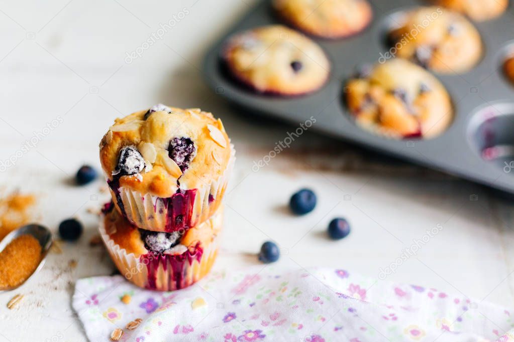 Freshly baked blueberry muffins with almond and oats topping