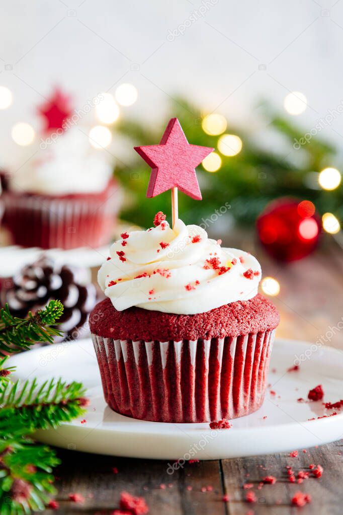 Christmas red velvet cupcake with a star cake pick