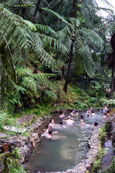 San Miguel, Portugal, June 2019. People bathe in pools of warm water in the middle of the forest. Thermal springs in Caldera Velha, Azores. — Stock Photo, Image