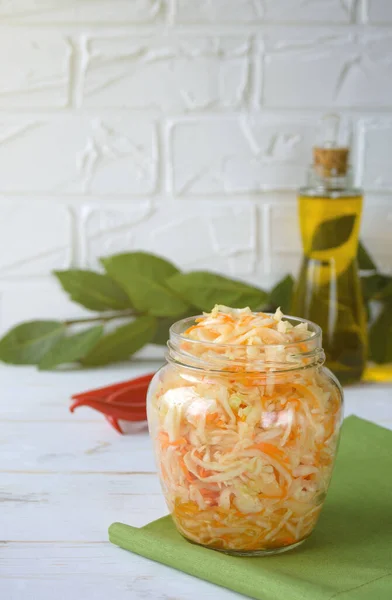 Fermented foods. Sauerkraut in a glass jar on a white background. Vegetarian food concept