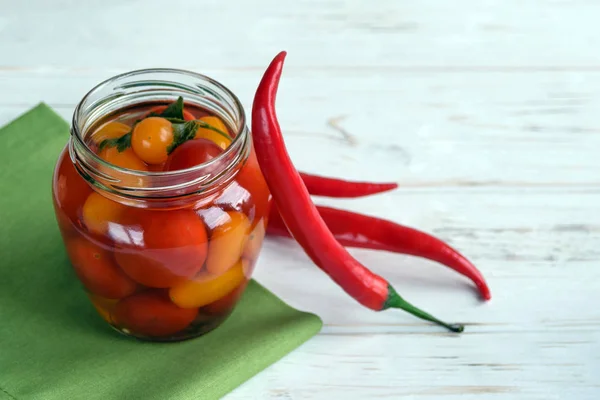 Fermented foods. Salted tomatoes in a glass jar on a white background. Vegetarian food. Super food. — Stock Image Fermented foods. Salted tomatoes in a glass jar on a white background. Vegetarian food. Super food. Royalty Free Stock Images