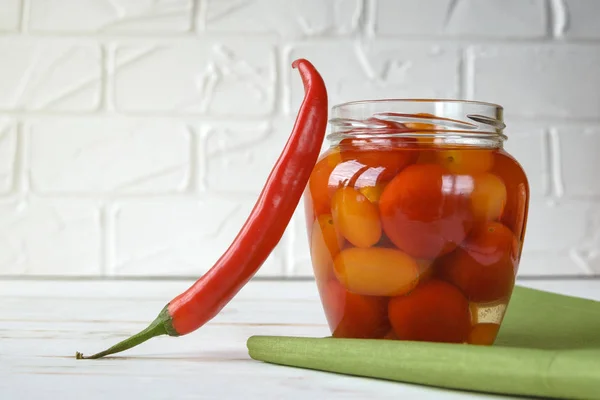 Fermented foods. Salted tomatoes in a glass jar on a white background. Vegetarian food. Super food. — Stock Image Fermented foods. Salted tomatoes in a glass jar on a white background. Vegetarian food. Super food. Stock Image