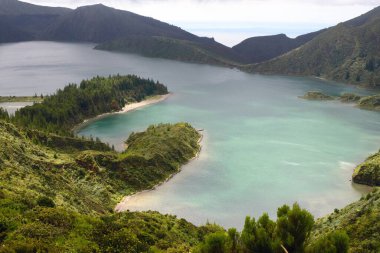 The beautiful crater of Lake Lagoa do Fogo in the stratovolcano Agua de Pau Massiva in the center of the island of San Miguel on the Portuguese archipelago of the Azores. Travel to the Azores.