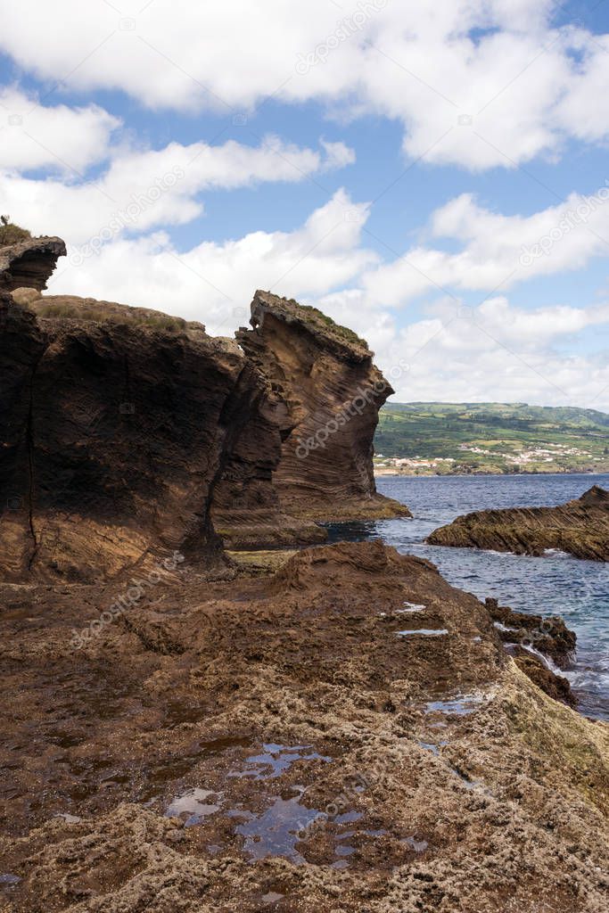 Amazing landscape in the Azores, Portugal. Large rocks against the blue sky on the uninhabited volcanic island of Vila Franca. Travel to the Azores.