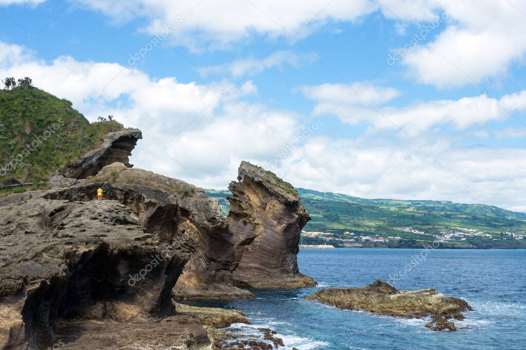 Amazing landscape in the Azores, Portugal. Large rocks against the blue sky on the uninhabited volcanic island of Vila Franca. Travel to the Azores.