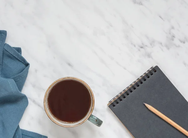 Kopje koffie en notebook — Stockfoto