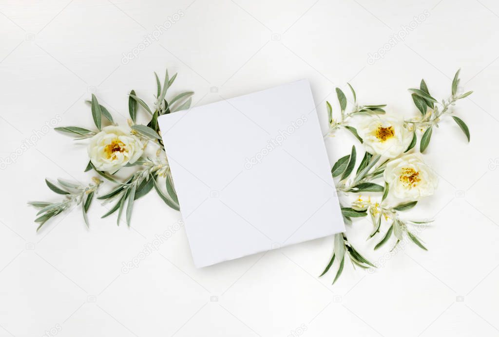 White paper card and white wild roses