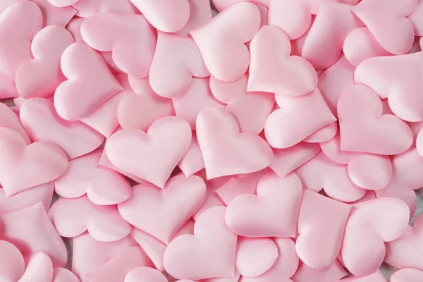 Background of pink silk hearts Stock Picture