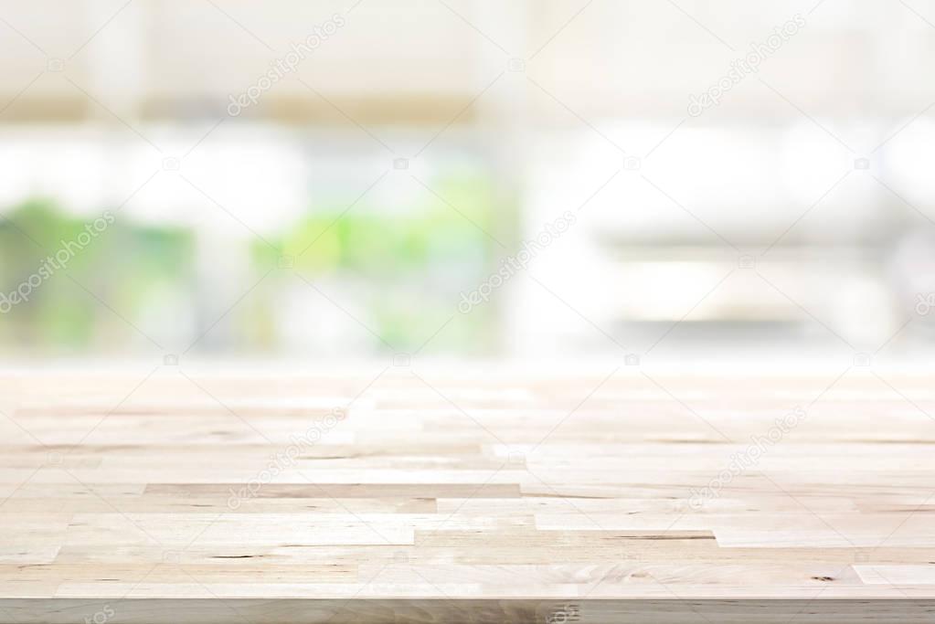 Wood table top on blur kitchen window background 