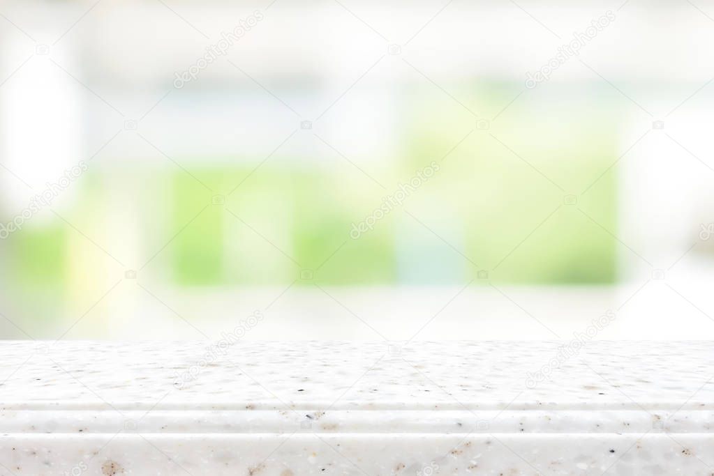 Stone countertop on blur kitchen window background
