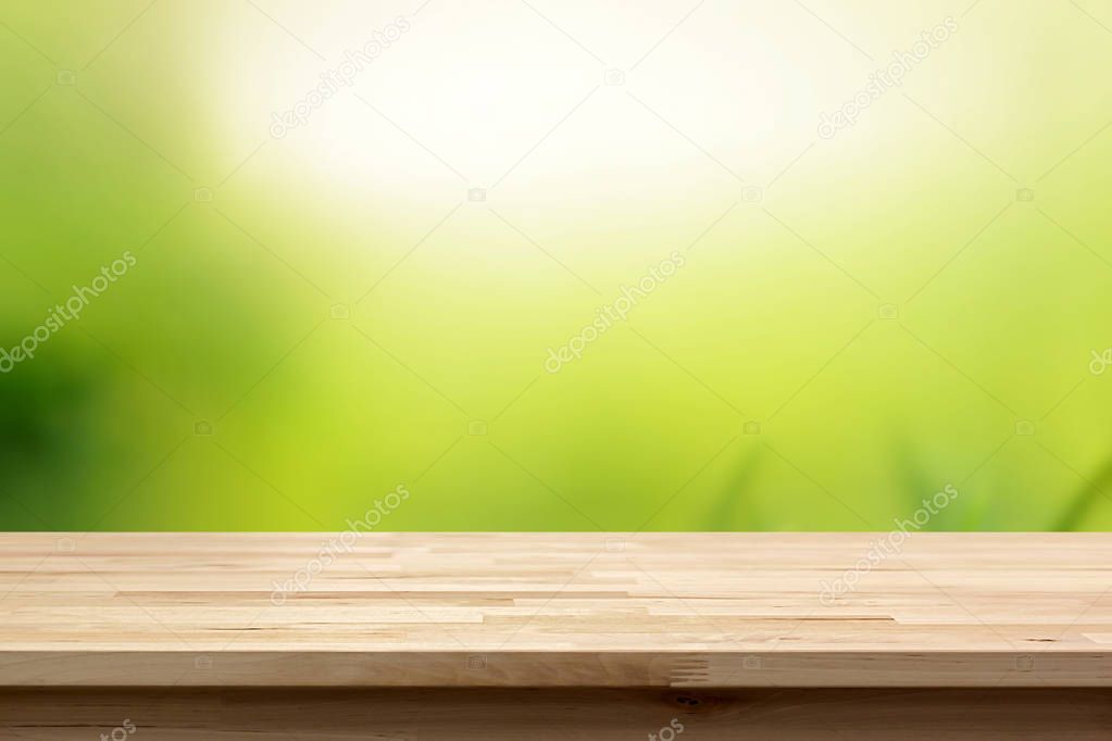 Wood table top on abstract  natural gradient green background