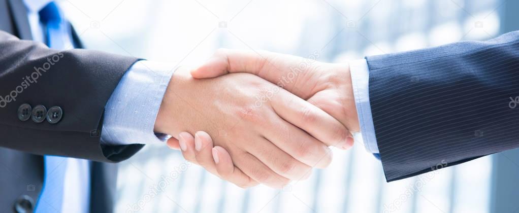 Close up of businessman hands making handshake