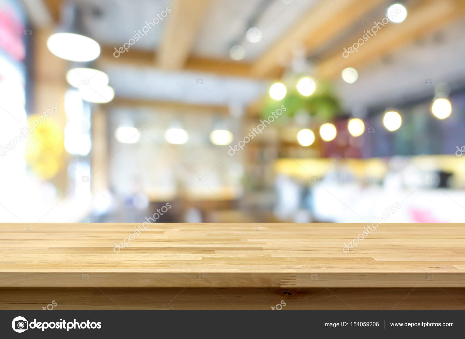 Wood table top on blur background of coffee shop (or restaurant) interior  Stock Photo by ©kritchanut 154059206
