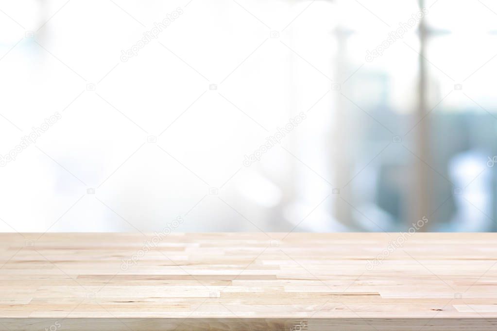 Wood table top on white blurred abstract background