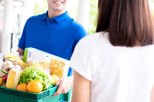 Delivery man delivering food to a woman