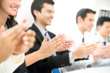 Group of business people applauding at the meeting clipart