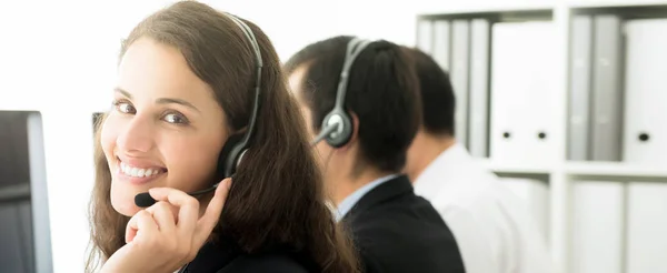 Smiling businesswoman in call center — Stock Photo, Image