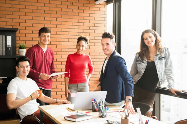 Casual mixed race business people in creative office — Stock Photo, Image