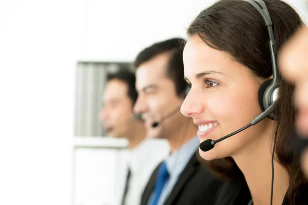 Smiling call center (or telemarketer) team — Stock Photo, Image
