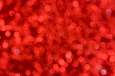 Kırmızı ışıltılı bokeh arka plan ışıltı